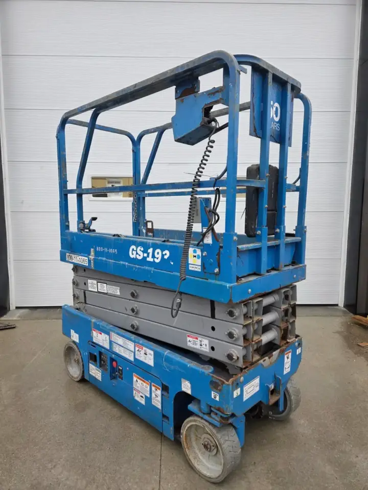 Blue Genie electric scissor lift with the platform lowered